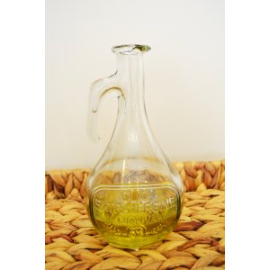 Botella para aceite de vidrio labrada con hoja